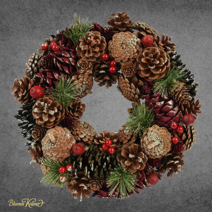 Zapfenkranz mit roten Beeren und Tanne für Weihnachtsdekoration in Zürich online kaufen