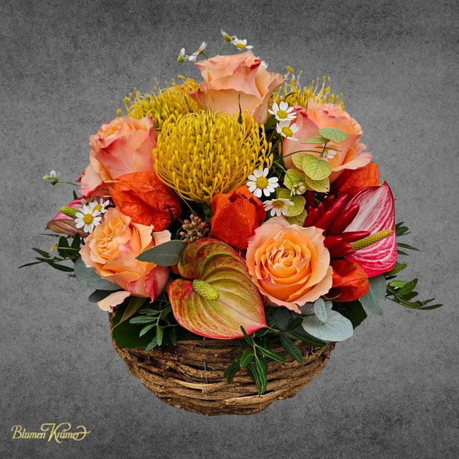 Bunter Blumenkorb mit herbstlichen Blumen in Orange aus Zürich online bestellen
