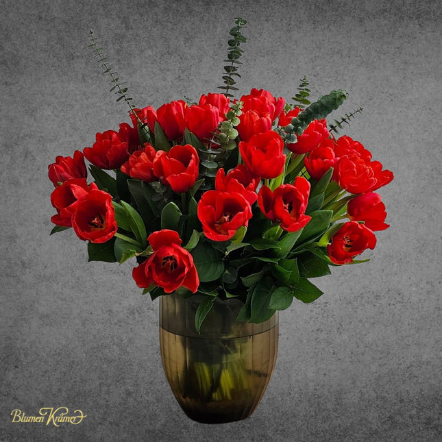 Red tulips with eucalyptus